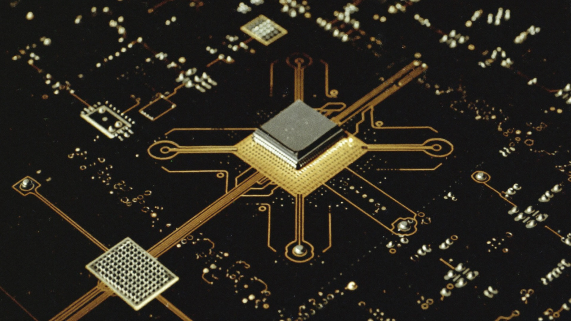 Golden circuit traces glowing like a city grid across dark silicon